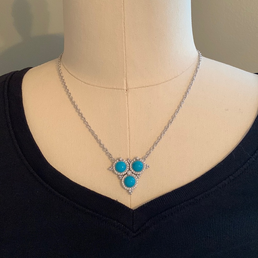 Sterling silver 18” necklace with 2” extender. Center drop W/3 turquoise stones.